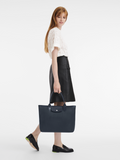 Longchamp-Le-Pliage-City-Top-Handle-Bag-Navy-Balilene-onmodel