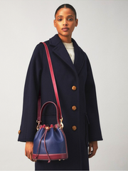 Tory-Burch-83052-T-Monogram-Colorblock-Bucket-Bag-In-Royal-Navy-Juneberry-Balilene-onmodel